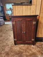 Wooden cabinet on casters