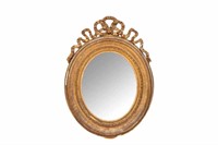ANTIQUE CARVED GILTWOOD OVAL MIRROR