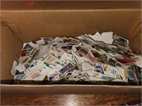 Box half full of Used Canadian Stamps - box
