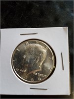 1964 uncirculated silver Kennedy half dollar