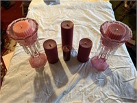 Set of pink candles and glasses.