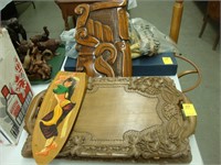 Two carved wooden trays along with two carved