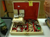 Jewelry box containing various costume jewelry.