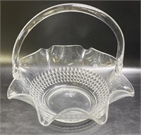 Large glass basket measuring 11 inches tall
