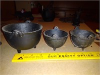 Three cast iron pots