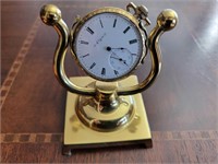 Elgin pocket watch with brass stand