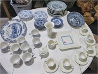 Table full of blue dishes & cups