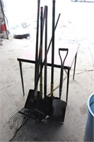 rake, shovels, spade in plastic barrel