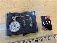 Pocket watch and chain in plastic case by