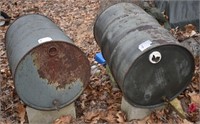 Two 55 gallon barrels:  one with some antifreeze a