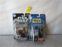 Two Star Wars action figures on card, one is Yoda