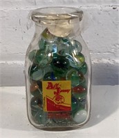 Vintage half pint milk bottle with old marbles