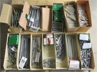 Pallet full of hardware that includes hex bolts,
