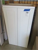 White (2) door wall cabinet. Measures 48" H x 25"