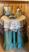 Covered decorator table with assorted angels