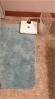 Bathroom scale, bathroom trashcan, rug