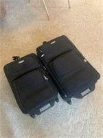 2 rolling suitcases