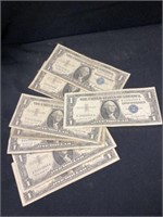 Seven $1.00 Silver Certificates