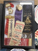 Large group of Oddfellows badges in ribbons case