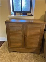 Storage cabinet with pull out shelf 29 inches