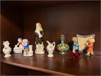 Collection of small, porcelain figurines. Sam is