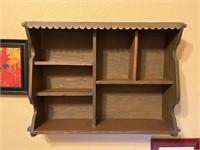 Display shelf. Dimensions are 27 inches wide 19
