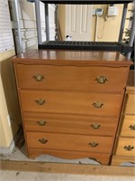 Chest of drawers appears to be solid wood