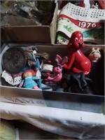 Shoe box of kids toys including a Pez dispenser