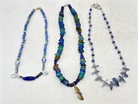 3 hand beaded art glass necklaces 
All approx