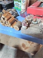 Rock and wood craft items including stack of wood