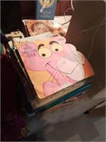 Stack of children's books including the Pink