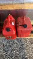 2-5 gallon plastic gas cans 1 full