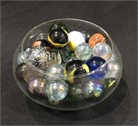 Group of large marbles in glass bowl