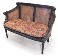 Exceptional cane inset carved settee