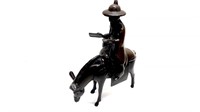 Statue of a Chinese Man on a Donkey