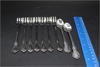 7 Cocktail Forks and 2 Ice Tea Spoons