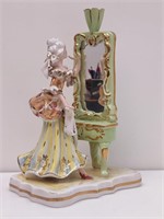 Lady Peering into vanity mirrior figurine C1950s