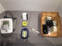 Blood pressure cuff, flip phone, misc