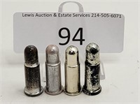 Four LECO USA Well Worn Silver Plastic Toy Bullets