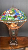Tiffany style shade over 3 bulb lamp base with