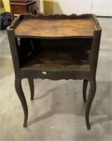 Antique telephone table with cool side drawers.