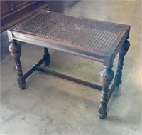 Antique cane top end table, measures 24 x 18 x