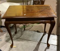 Dark stained wooden side table with pull out