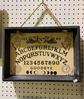 Framed Ouija board wall hanger measures 16x12.