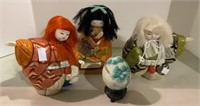A lot of three oriental dolls and one hand painted