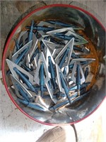 Bin full of arrow tips points for bow and arrow