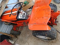 1Antique Orange lawn tractor mower looks like