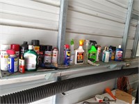 Shelf of cleaners and paint all pictured