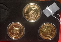 Three 1997 Gold Plated Grand Casino Medallions