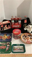 Assorted Coca Cola collectibles, bottles, tins,
